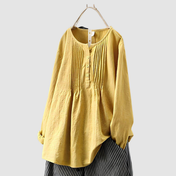 Mustard yellow blouse with button placket, pleated yoke, and long puff sleeves