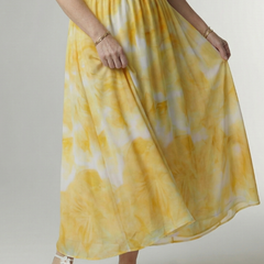 Yellow tie-dye halter midi dress detail: gathered skirt and elastic smocked waistband