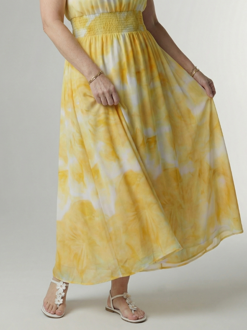 Yellow tie-dye halter midi dress detail: gathered skirt and elastic smocked waistband