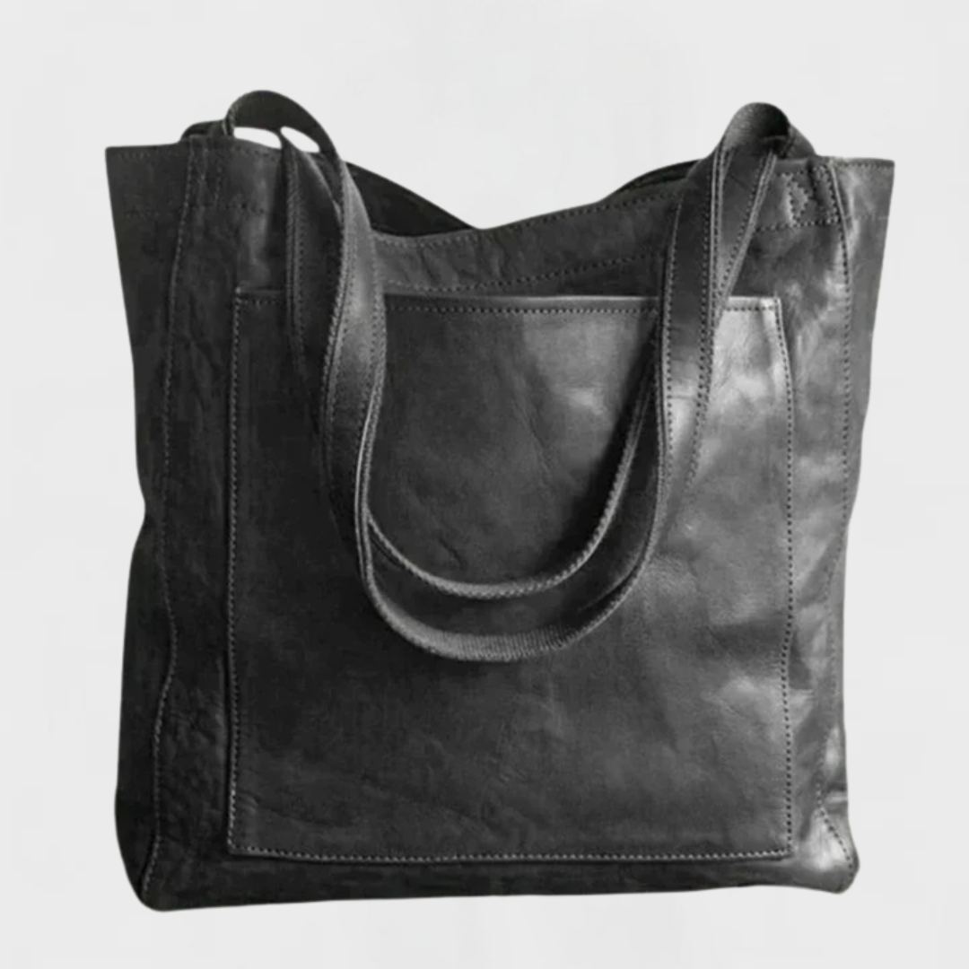 Black leather tote bag with double top handles and front seam detail