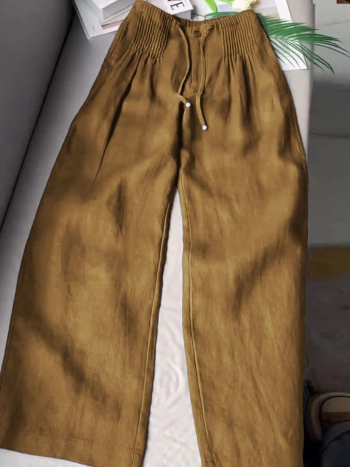 Khaki wide-leg trousers with elastic waistband, drawstring, and front button