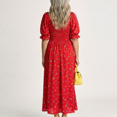 Red floral midi dress back view with square neckline, puff sleeves, and gathered waist