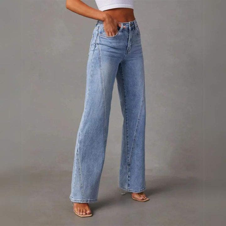 Light blue flared jeans with visible seams, front pockets, and ankle-grazing flare