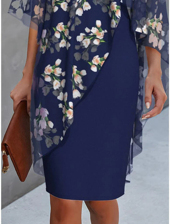 Navy floral sheath dress with draped cape overlay and three-quarter sheer sleeves