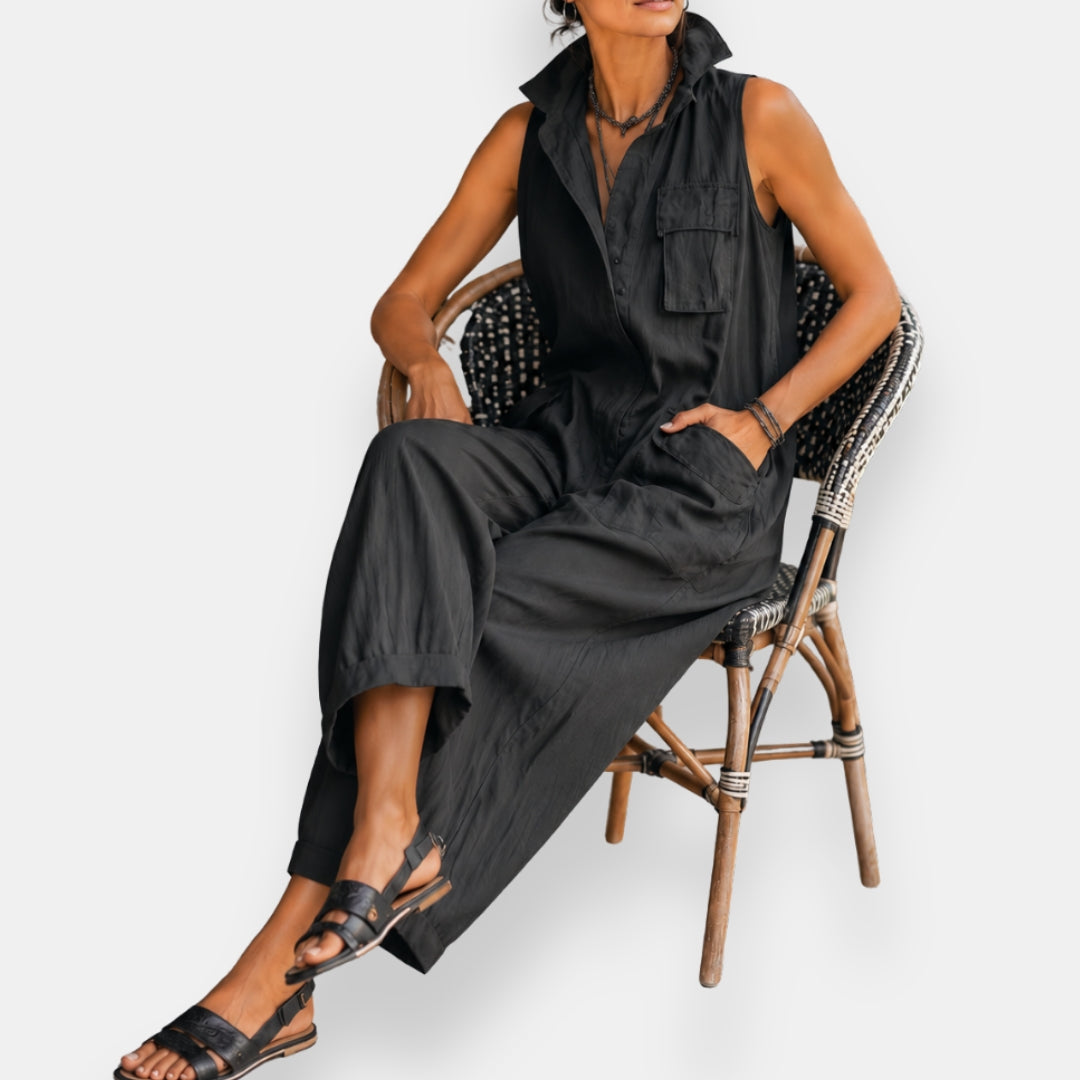 Black oversized sleeveless jumpsuit with chest pocket and wide leg silhouette