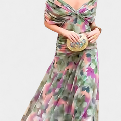 Long multicolor floral dress with off-shoulder twist top and flowing pleated skirt