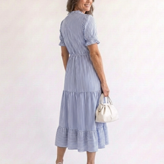 Sky blue striped tiered midi dress with tiered skirt and short puff sleeves, side view