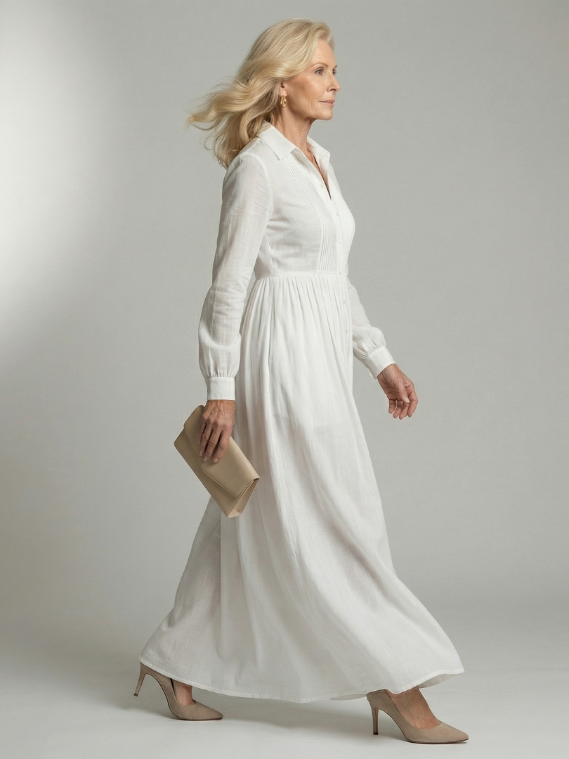 White soft flow maxi dress with V-neck, long sleeves, gathered skirt and flowing hem