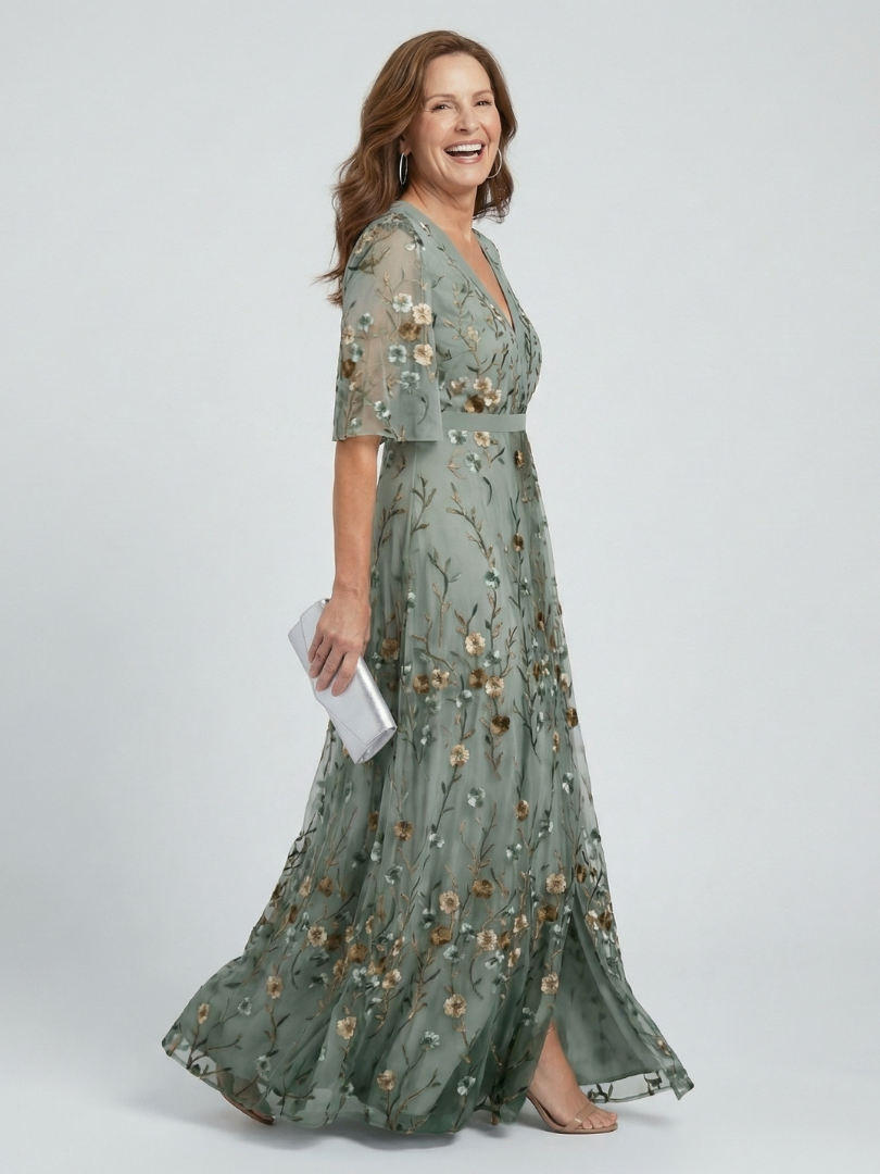 Sage green V-neck halter maxi dress with floral print, short sleeves and tiered flowy skirt