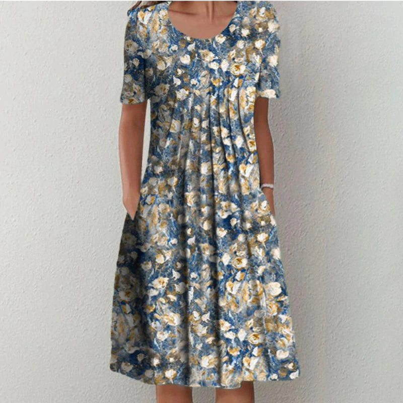 Coverage dress, blue base with yellow and white flower pattern, short sleeves