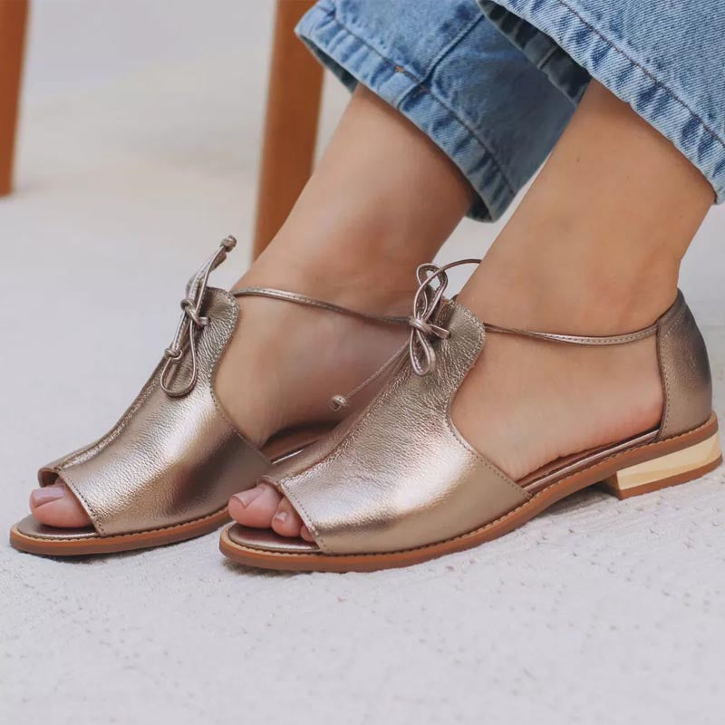 Metallic bronze leather sandals with crisscross straps and open toe
