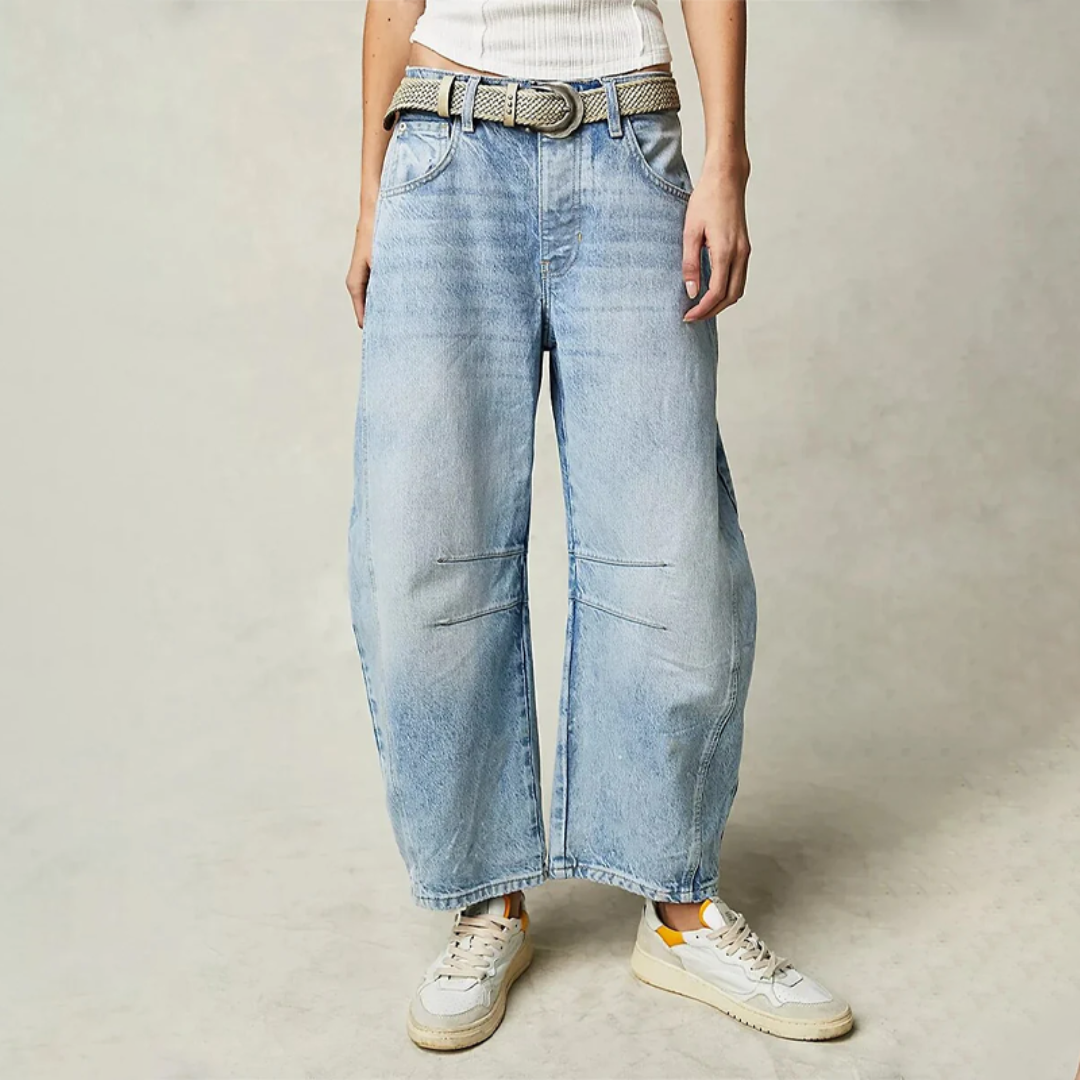Light blue wide-leg jeans with belt loops, button closure, and front patch pockets.