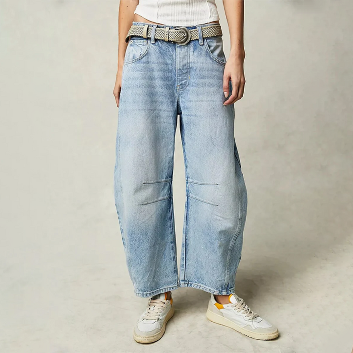 Light blue wide-leg jeans with belt loops, button closure, and front patch pockets.