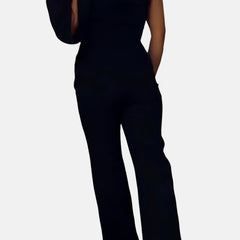 Black wide-leg jumpsuit with V-back and one-shoulder strap detail