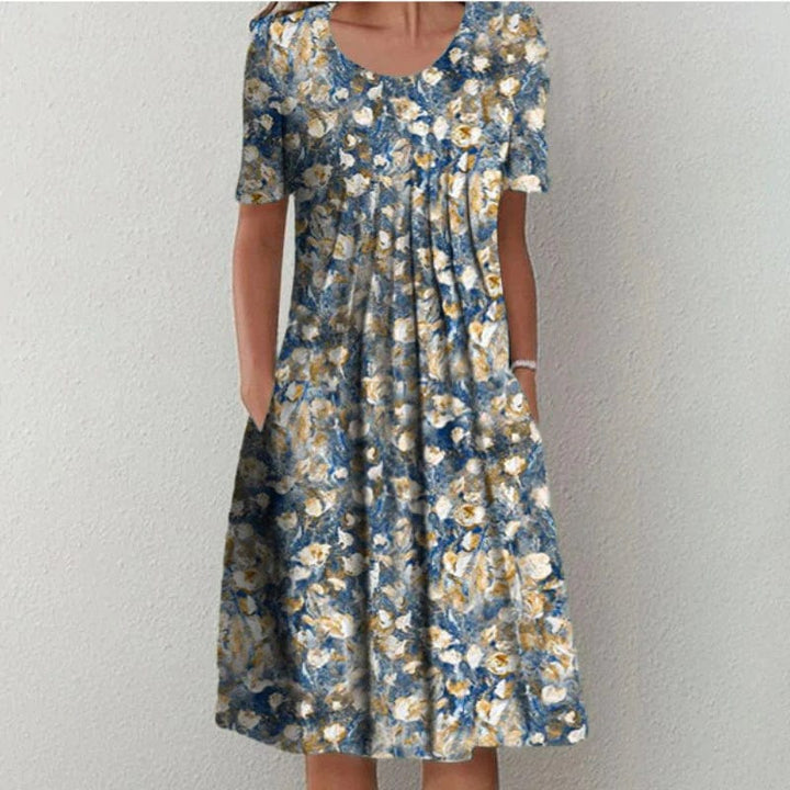 Blue floral dress with scoop neck, short sleeves, ruched tiered skirt