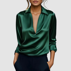 Green satin blouse with pointed collar, deep V-neck, long sleeves, button cuffs.