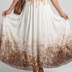 Pleated midi dress skirt close-up with white fabric and brown leopard print