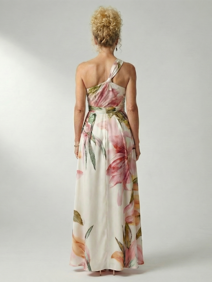 Floral halter backless maxi dress; cream base with pink and green leaf print