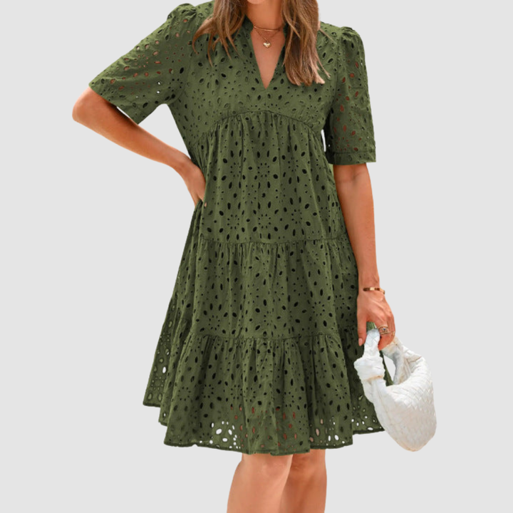 Dark green V-neck tiered babydoll summer dress, short sleeves, dotted pattern.