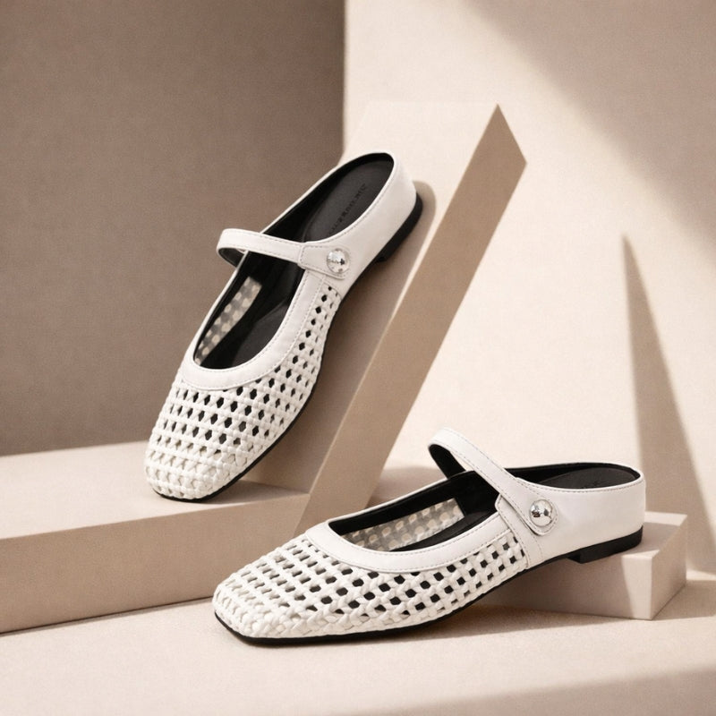 White woven orthopedic mule flats with round toe, slip-on back, top strap with button