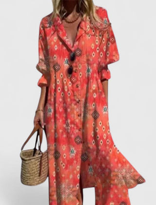 Red boho dress with ornate geometric print, V-neck with black buttons and short sleeves