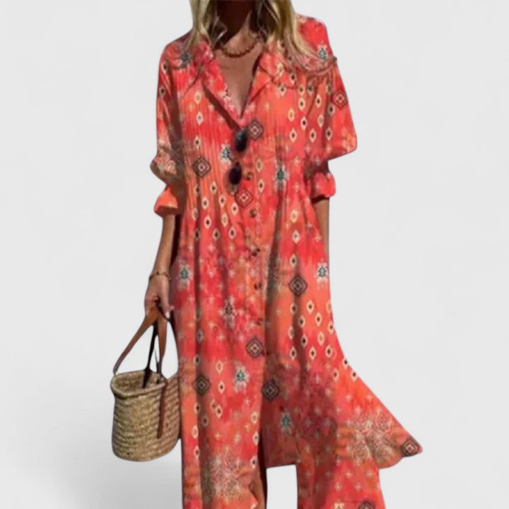 Red boho dress with ornate geometric print, V-neck with black buttons and short sleeves
