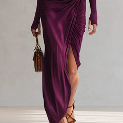 Plum draped maxi dress with one-shoulder neckline, thigh-high slit, long sleeve