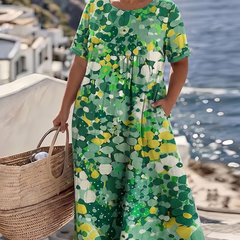 Green floral midi dress with short sleeves and round neckline, loose gathered skirt