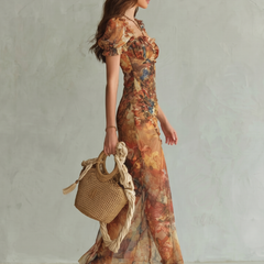 Multicolor ruched midi dress with ruffled sleeves and side slit, floral print.