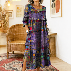 Purple-and-multicolor patchwork midi dress with round neck, long sleeves, and slit