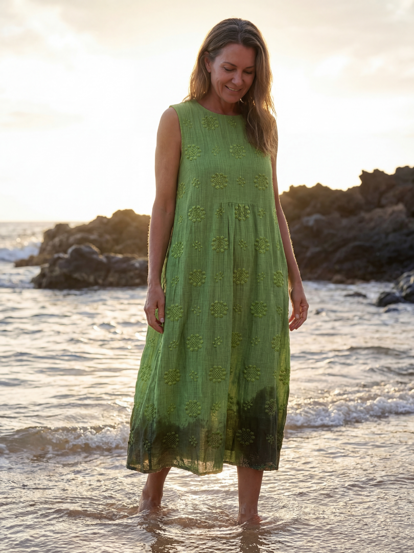 Green sleeveless midi dress with small floral embroidery and tiered hem