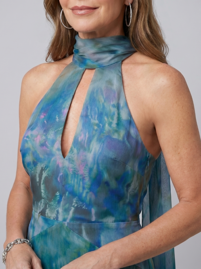 Close-up of blue printed halter maxi dress with keyhole neckline