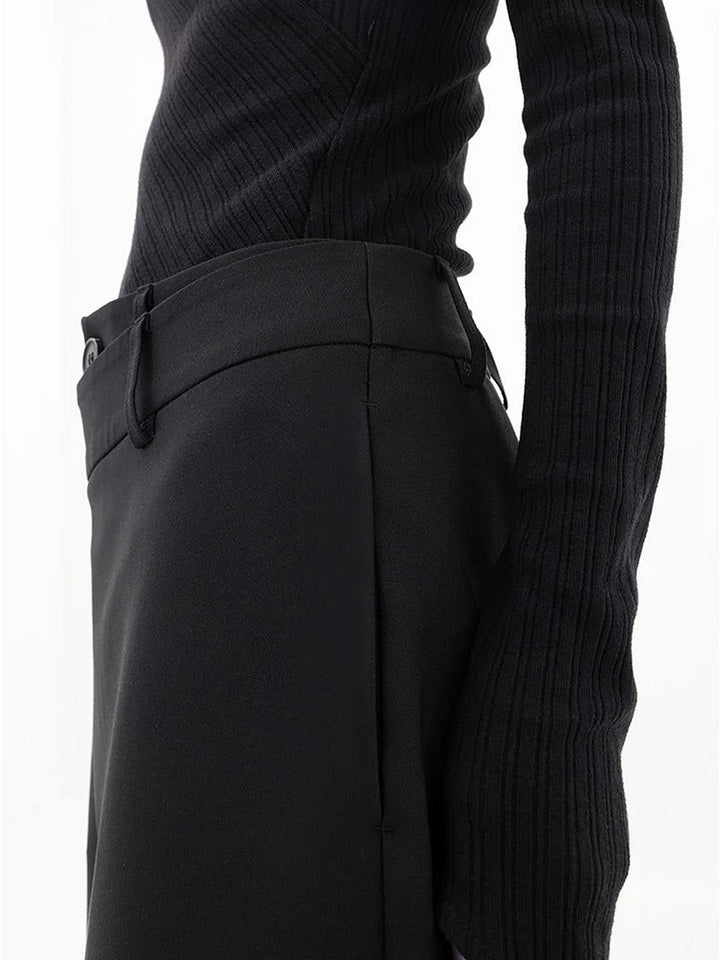 Black baggy trousers back view with fitted waistband and wide leg