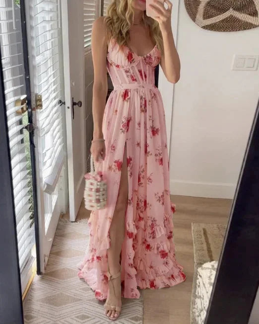 Pink floral maxi dress with spaghetti straps, cinched waist, and ruffled tiered hem
