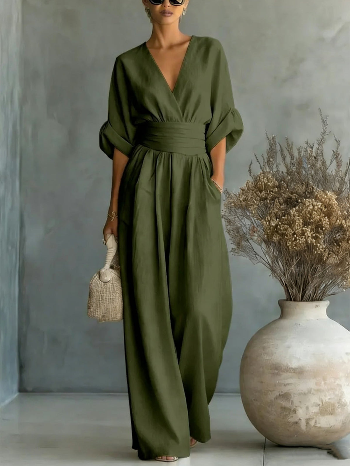 Women’s wide-leg jumpsuit in olive green with V-neck and loose gathered waist