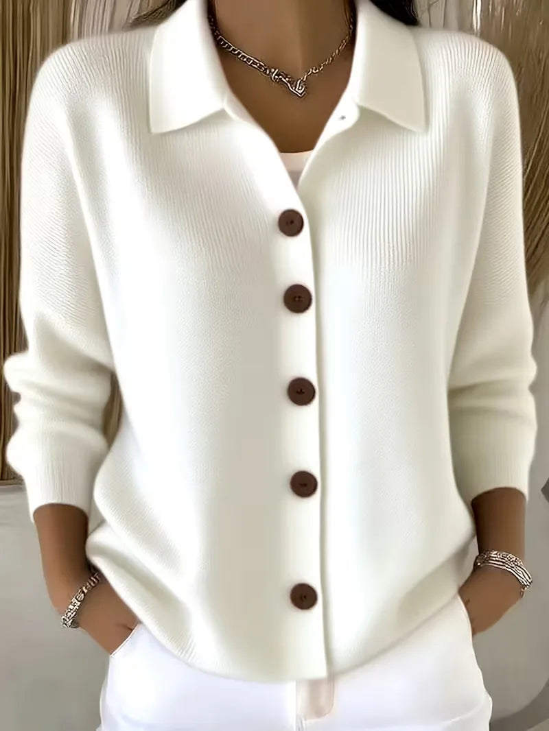 White button-front knit cardigan with point collar and dark buttons, long sleeves