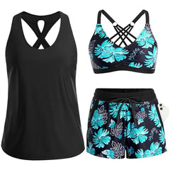 Black tropical swim set with crisscross cutout tank, teal floral bra, and drawstring shorts