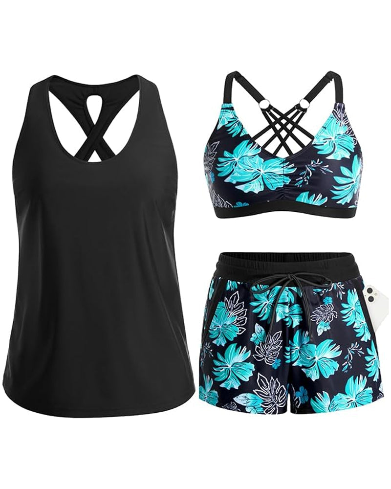 Black tropical swim set with crisscross cutout tank, teal floral bra, and drawstring shorts