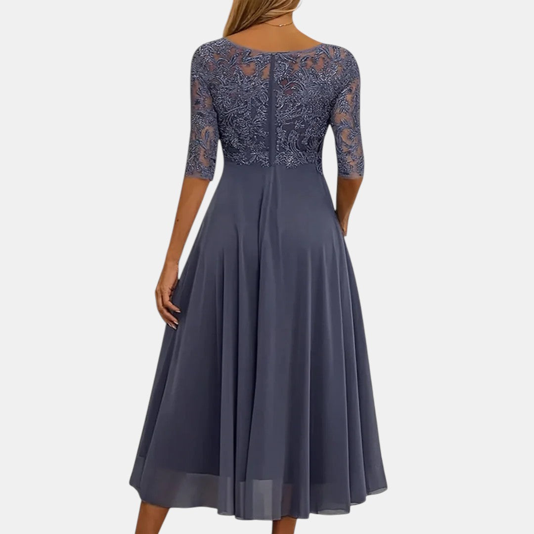 Navy blue elegant dress back view with lace sleeves and pleated midi skirt