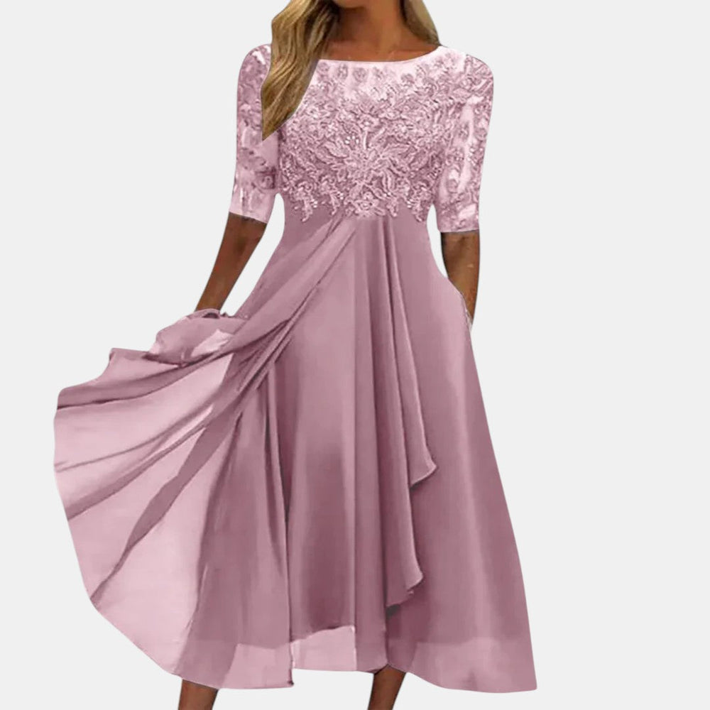Pink elegant dress with lace bodice, 3/4 sleeves, and flowing pleated A-line skirt