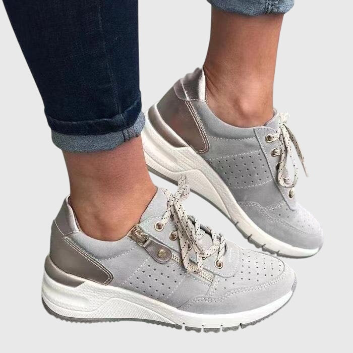 Light gray orthopedic sneakers with lace-up, perforated design and padded collar