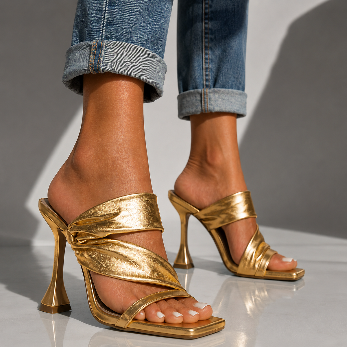 Champagne gold heeled sandals with open toe and twisted front strap
