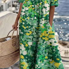 Green floral midi dress with short sleeves and flowy A-line midi hem