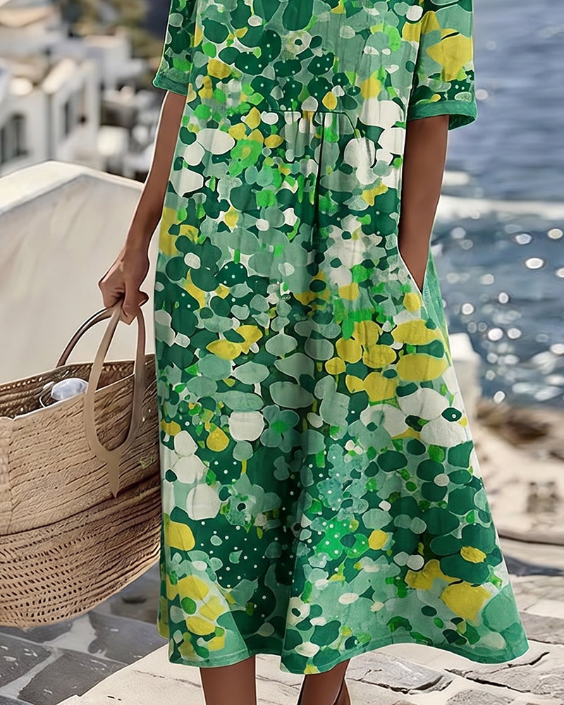 Green floral midi dress with short sleeves and flowy A-line midi hem