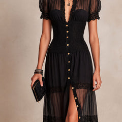 Black maxi dress with V neckline, puff sleeves, gold buttons and tiered sheer skirt