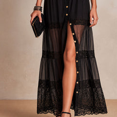 Black tiered maxi skirt with lace hem and gold-button front detail, sheer panels