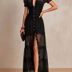 Black maxi dress with sheer tiered skirt, puff sleeves, gold-button front and lace hem