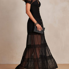 Black maxi dress in sheer tiers with scalloped lace hem, short puff sleeves and button front