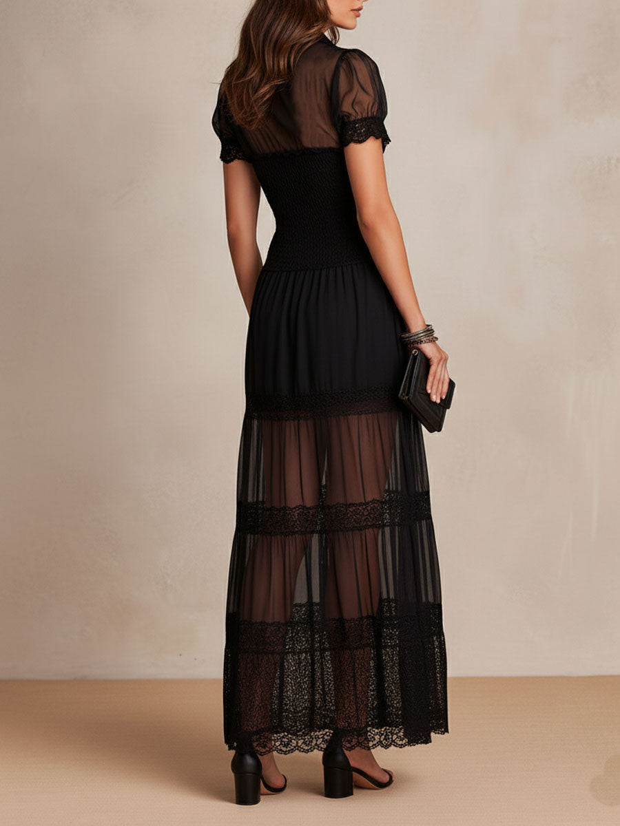 Black maxi dress, short puff sleeves and tiered skirt with lace trim; buttoned bodice