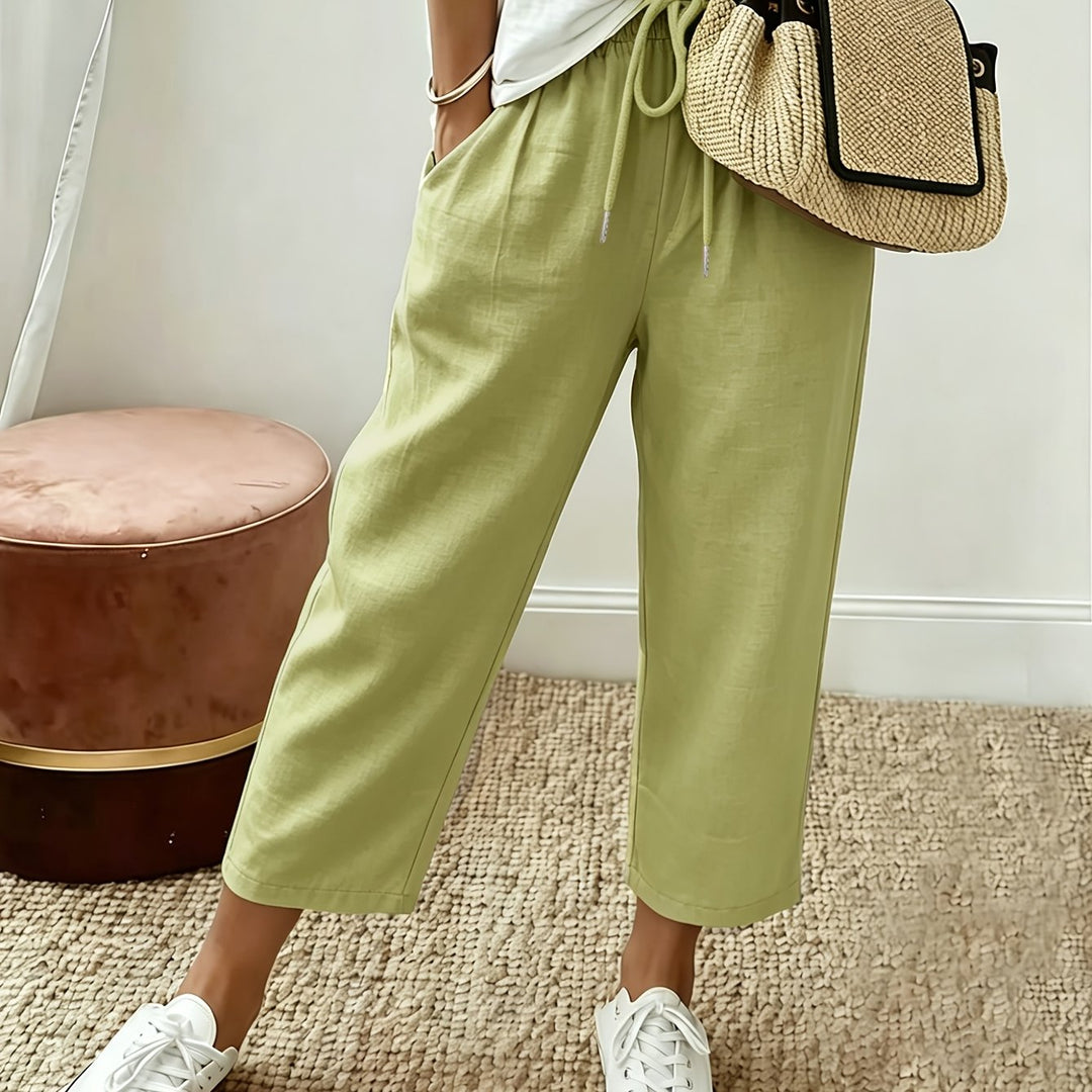 Light green cropped wide-leg trousers with drawstring waist and ankle-length hem